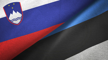 Slovenia and Estonia two flags textile cloth, fabric texture