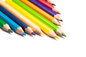 Colored pencils background with a variety of colors. Many different color pencils on white background. Colored Pencils for School or Professional Use.