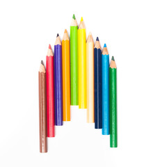 Colored pencils background with a variety of colors. Many different color pencils on white background. Colored Pencils for School or Professional Use.