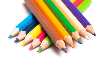 Colored pencils background with a variety of colors. Many different color pencils on white background. Colored Pencils for School or Professional Use.