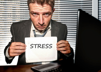 young desperate and stressed business man working overwhelmed at office computer desk feeling...