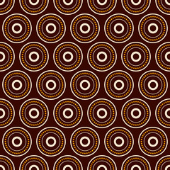 Abstract seamless vector pattern with beige and yellow dotted circles, rings on brown background.