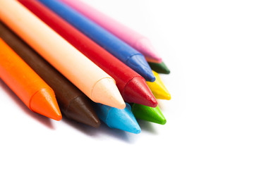 Colorful wax crayons collection isolated on white background. Colorful multi colored crayons for school ,kids and professional use.