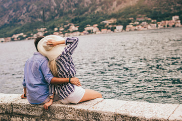Couple in love, enjoying the summer time by the sea.