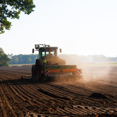 Field work with the tractor on the field © Dar1930