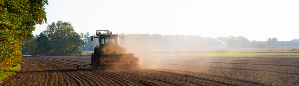 Fototapeta Field work with the tractor on the field