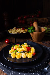 crispy gnocchi with roasted asparagus and tomatoes