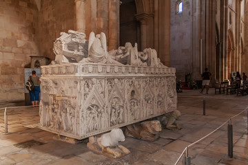 Alcobaca, Portugal. Gothic Tomb of Queen Ines de Castro with recumbent effigy and angels. Monastery of Santa Maria de Alcobaca Abbey. Funerary art masterpiece.