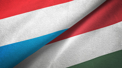 Fototapeta na wymiar Luxembourg and Hungary two flags textile cloth, fabric texture