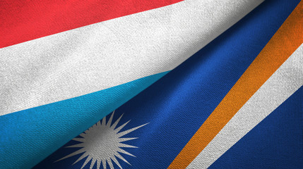 Luxembourg and Marshall Islands two flags textile cloth, fabric texture