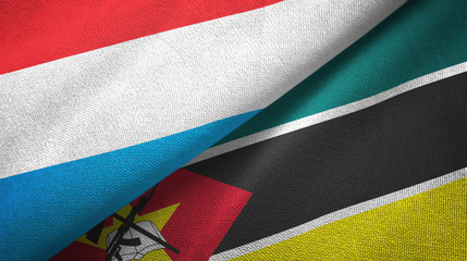 Luxembourg and Mozambique two flags textile cloth, fabric texture