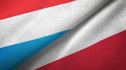 Fototapeta na wymiar Luxembourg and Poland two flags textile cloth, fabric texture