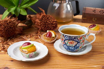 fruit tart and beverages on wood table