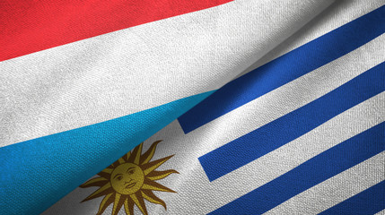 Luxembourg and Uruguay two flags textile cloth, fabric texture