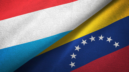 Luxembourg and Venezuela two flags textile cloth, fabric texture