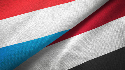 Luxembourg and Yemen two flags textile cloth, fabric texture