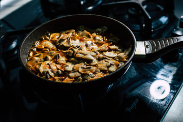 Fried mushrooms on a frying pan