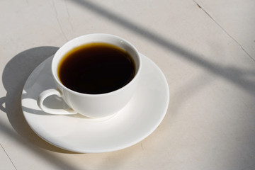 Fragrant coffee in a white cup on the nature.