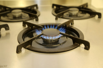 Burning gas, gas stove burner, hob in the kitchen