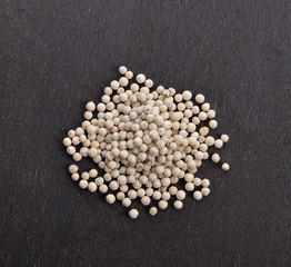 white pepper on black background