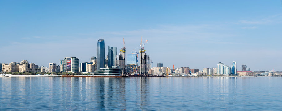 Baku, Azerbaijan - April 13, 2019: Panoramic sunny summer view of Baku, capital city of Azerbaijan. Panorama Baku from The Caspian Sea © studiographicmh