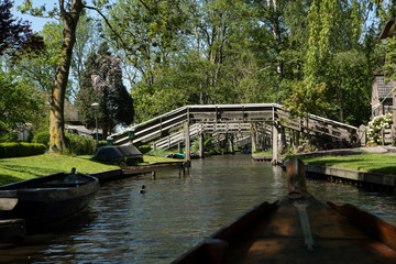 Fototapeta na wymiar Giethoorn watervillage Overijssel Netherlands. Canals and bridges