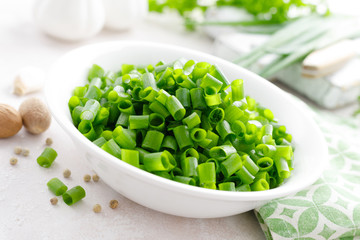 Fresh green onion sliced in bowl