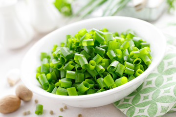 Fresh green onion sliced in bowl