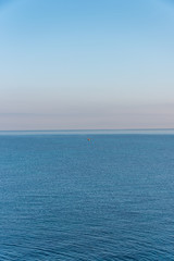 Obraz premium Tiny Fishing Boat on the Southern Italian Mediterranean Sea at Sunrise