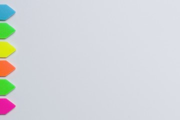 Construction paper with color tags, large signature space on a white background