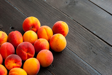 peaches on black wood table