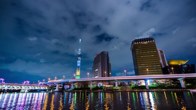 time lapse of Tokyo skyline on the Sumida River at night, Japan