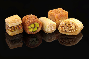 Middle eastern, Turkish sweet pastry baklava isolated on black background