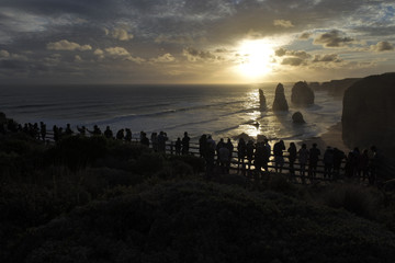 Silhouette of Tourists looking at the Twelve Apostles Great Ocean Road in Victoria Australia