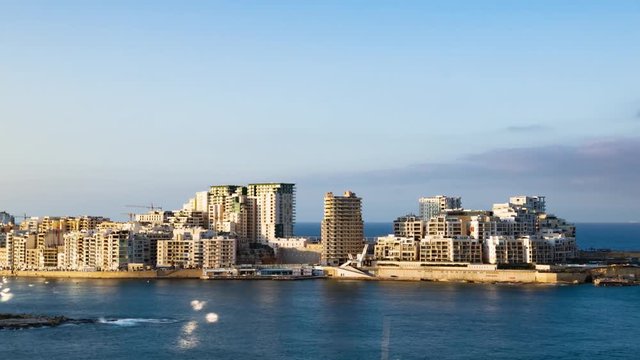 Panning time lapse view of the seafront of Sliema seen from Villetta, Malta