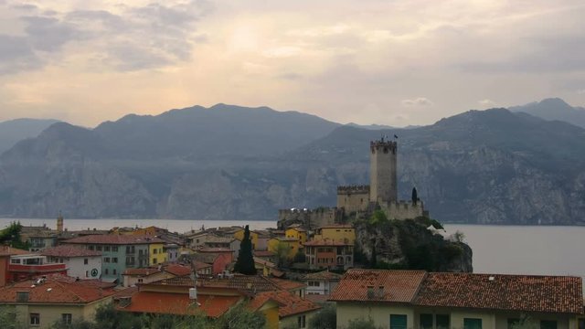 italian village skyline of Malcesine peaceful panoramic town on Garda Lake waterfront romantic horizontal panorama and idyllic picturesque castle