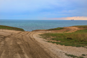 dirt road to the beach on the sea
