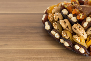 Obraz na płótnie Canvas the special dried fruits and nuts plate concept for store seller. dried apricot,fig ,hazelnut, nut,special Turkish east food.
