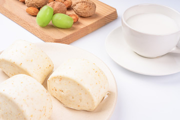 Dried fruit and milk bread on a white background
