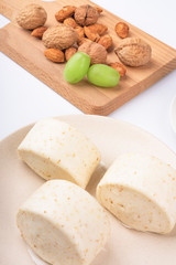 Dried fruit and milk bread on a white background