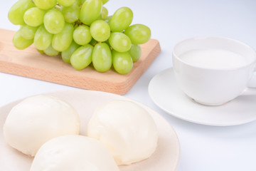 Green Tie and Milk Bread on a White Background