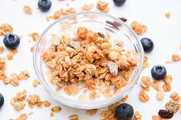 Crunchy muesli and blueberry Breakfast cereals isolated on white background, selective focus, top view