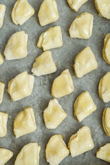 Cottage cheese cookies are on a baking sheet before cooking in the oven