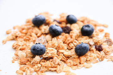 Crunchy muesli and blueberry Breakfast cereals isolated on white background, selective focus, top view