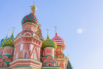 Fototapeta na wymiar St Basil's cathedral on Red Square in Moscow. Domes the cathedral against blue sky. Copy space