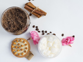 Coffee homemade body scrub with cinnamon, coconut oil and sugar on a white table