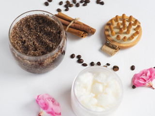 Coffee homemade body scrub with cinnamon, coconut oil and sugar on a white table
