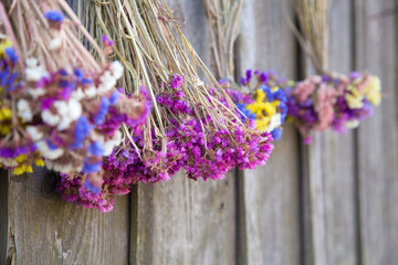 Dried flowers hanging on a wooden wall