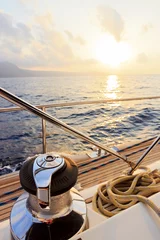 Foto auf Acrylglas Yacht sailing towards the sunset © Plamen