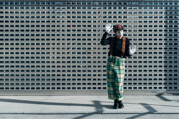 Mime happy gesticulating in the street